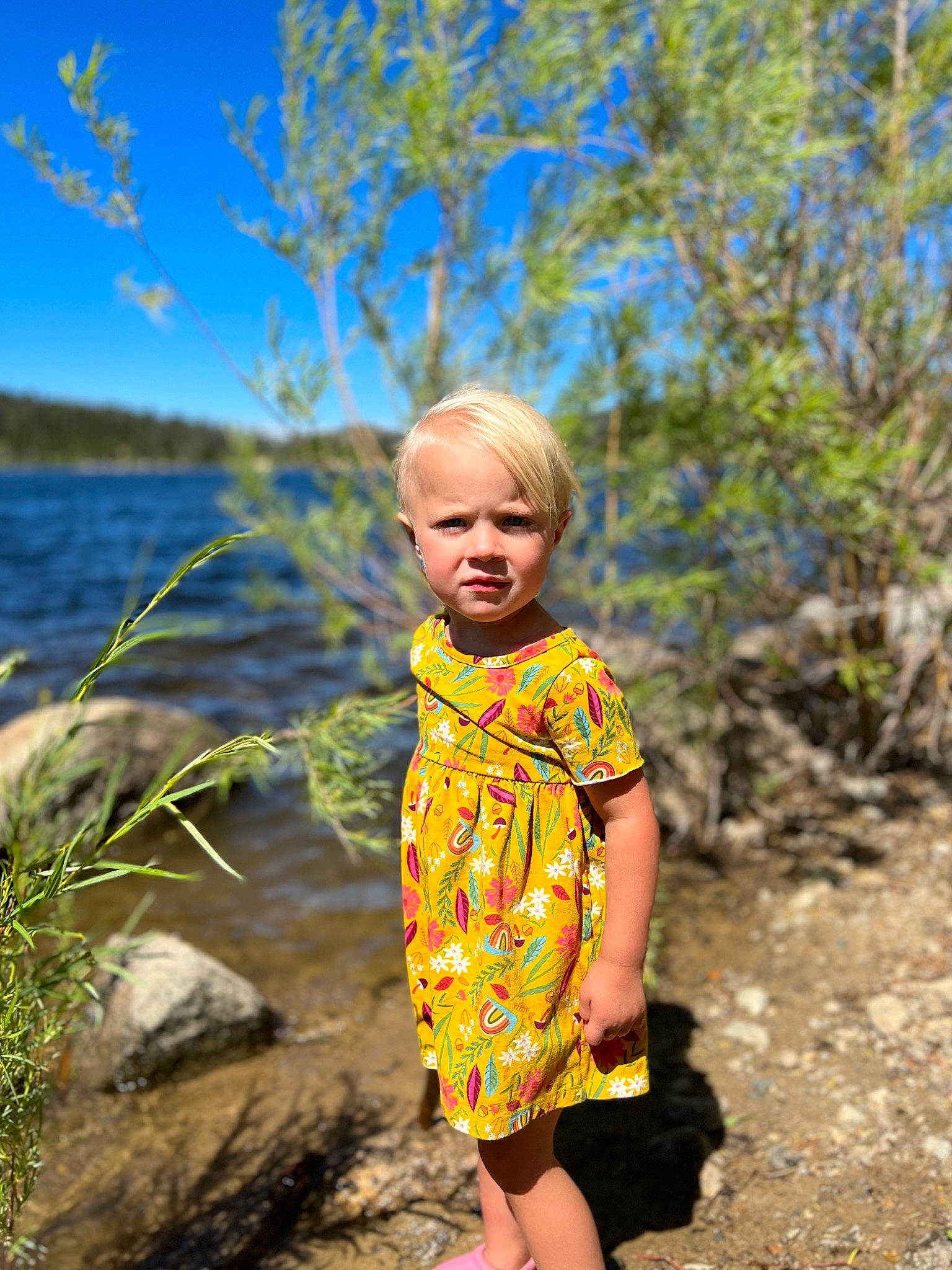 Emma is registered to the contest to win money with this photo: blond, electric_blue, flash_photography, fun, grass, hair, hairstyle, happy, leaf, leisure, nature, people_in_nature, person, plant, sand, sky, summer, toddler, tree, water
