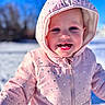 child, toddler, winter_clothing, pink_jacket, hood, smiling, outdoor, snow, blue_sky, cold_weather, happy, face, cute, polka_dots, portrait, baby, person, seasonal, winter, fun