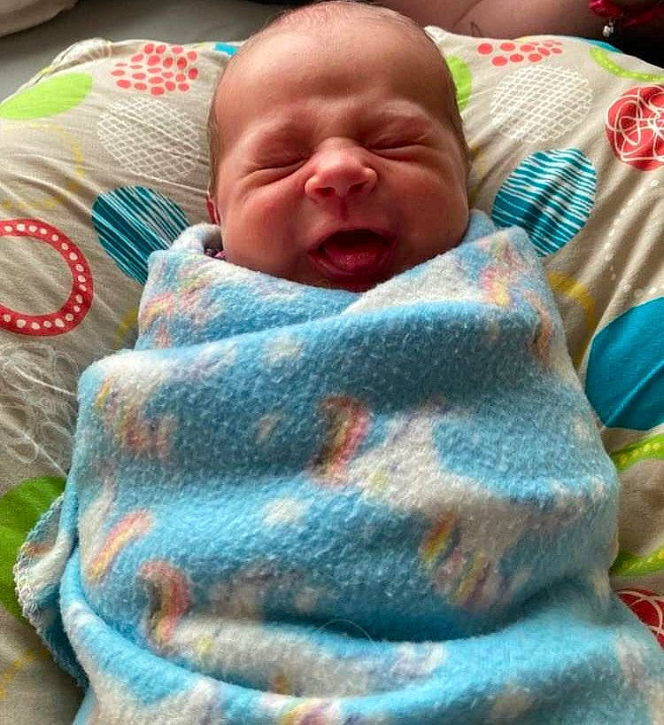 Ember is registered to the contest to win money with this photo: baby, baby_sleeping, baby_toddler_clothing, bedding, bedtime, cheek, child, comfort, green, happy, linens, nap, pattern, person, product, skin, sleeve, textile, toddler, woolen