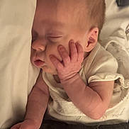Evelyn Marie joined the competition — help win amazing prizes! baby, sleeping, infant, hand, face, blanket, bed, peaceful, cute, newborn, soft, rest, cozy, skin, pajamas, child, portrait, closeup, comfort, relaxation