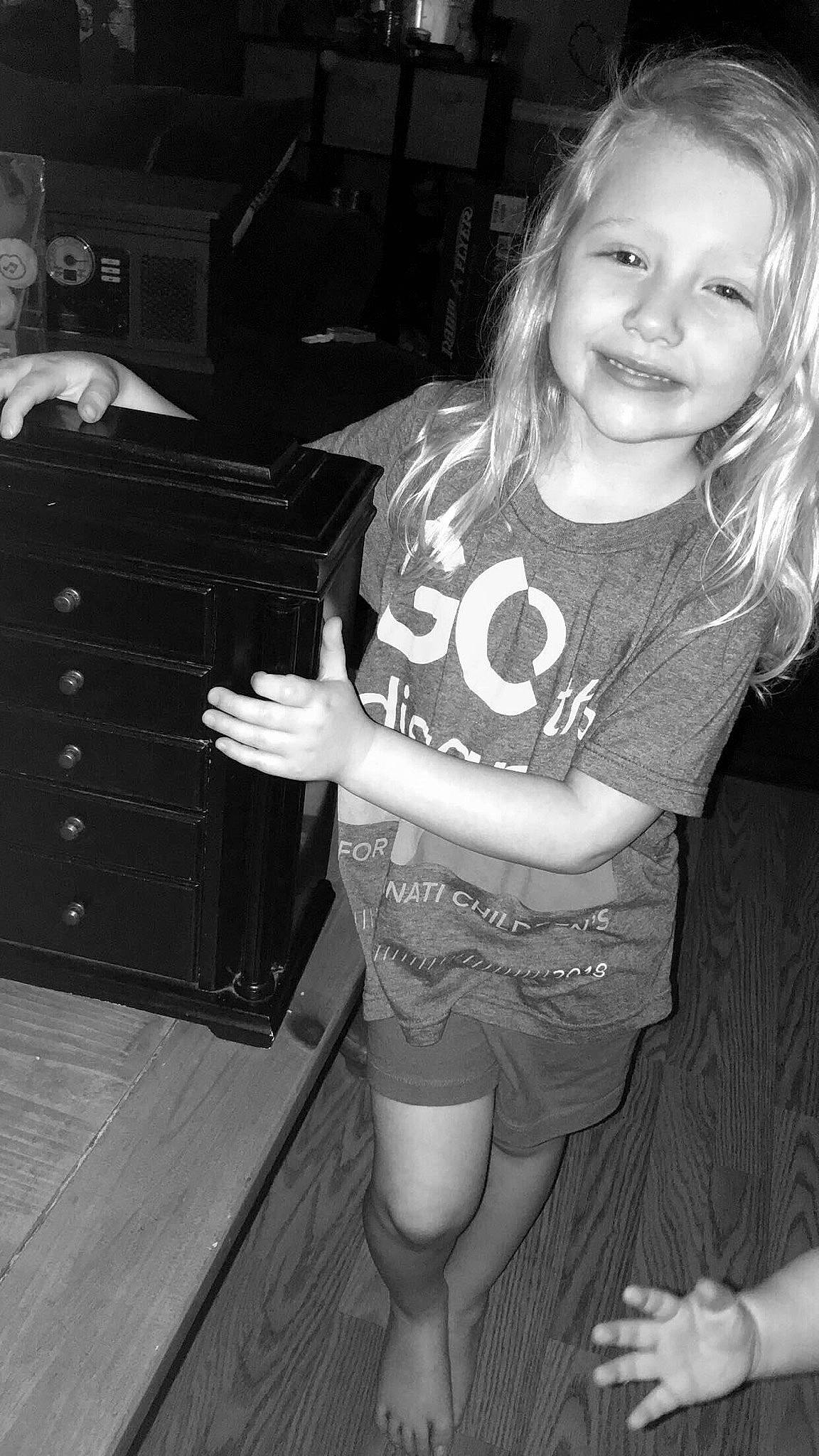 Scarlett is registered to the contest to win money with this photo: arm, black, black_and_white, child, cool, facial_expression, fun, hand, joy, leg, long_hair, monochrome, monochrome_photography, person, photograph, photography, smile, snapshot, standing, style