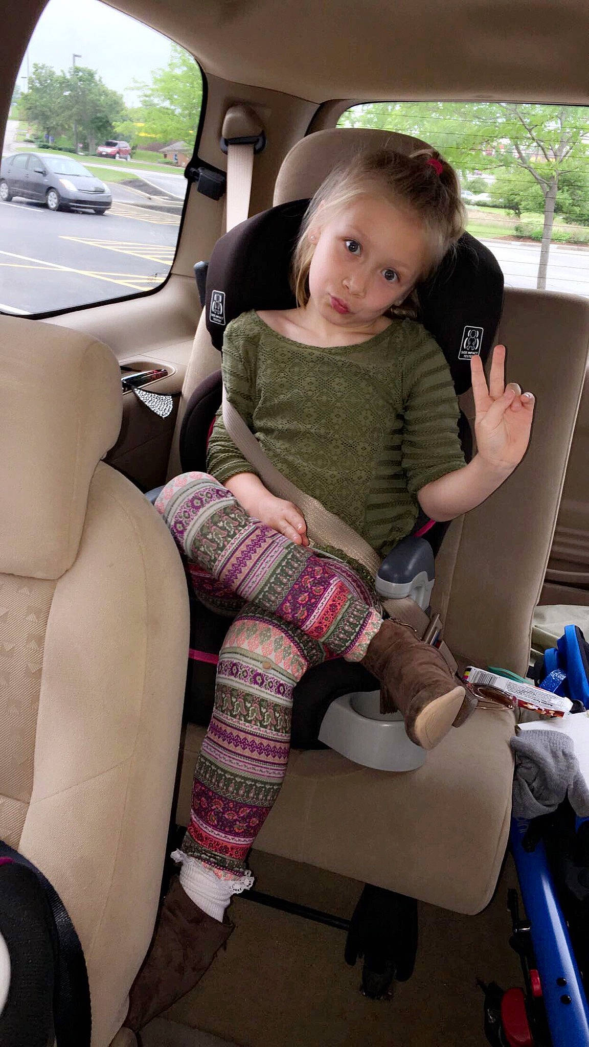 Allena is registered to the contest to win money with this photo: auto_part, car, car_seat, car_seat_cover, child, family_car, leg, person, sitting, toddler, vehicle