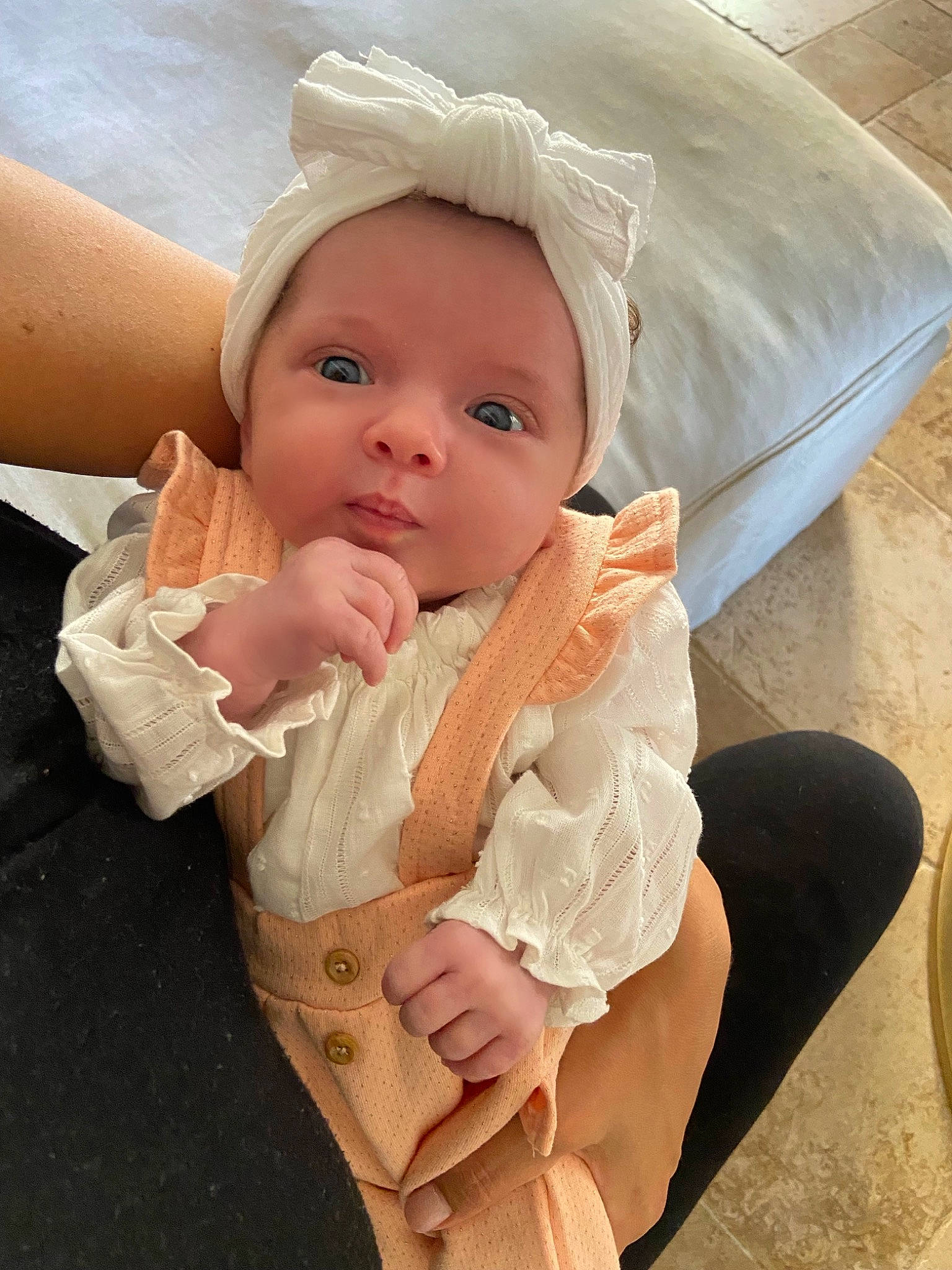 Giulia participe au concours pour gagner de l'argent avec cette photo : baby, baby_products, baby_toddler_clothing, cheek, chin, comfort, dress, eye, fashion_accessory, gesture, linens, lip, nail, neck, person, skin, sleeve, textile, thumb, toddler