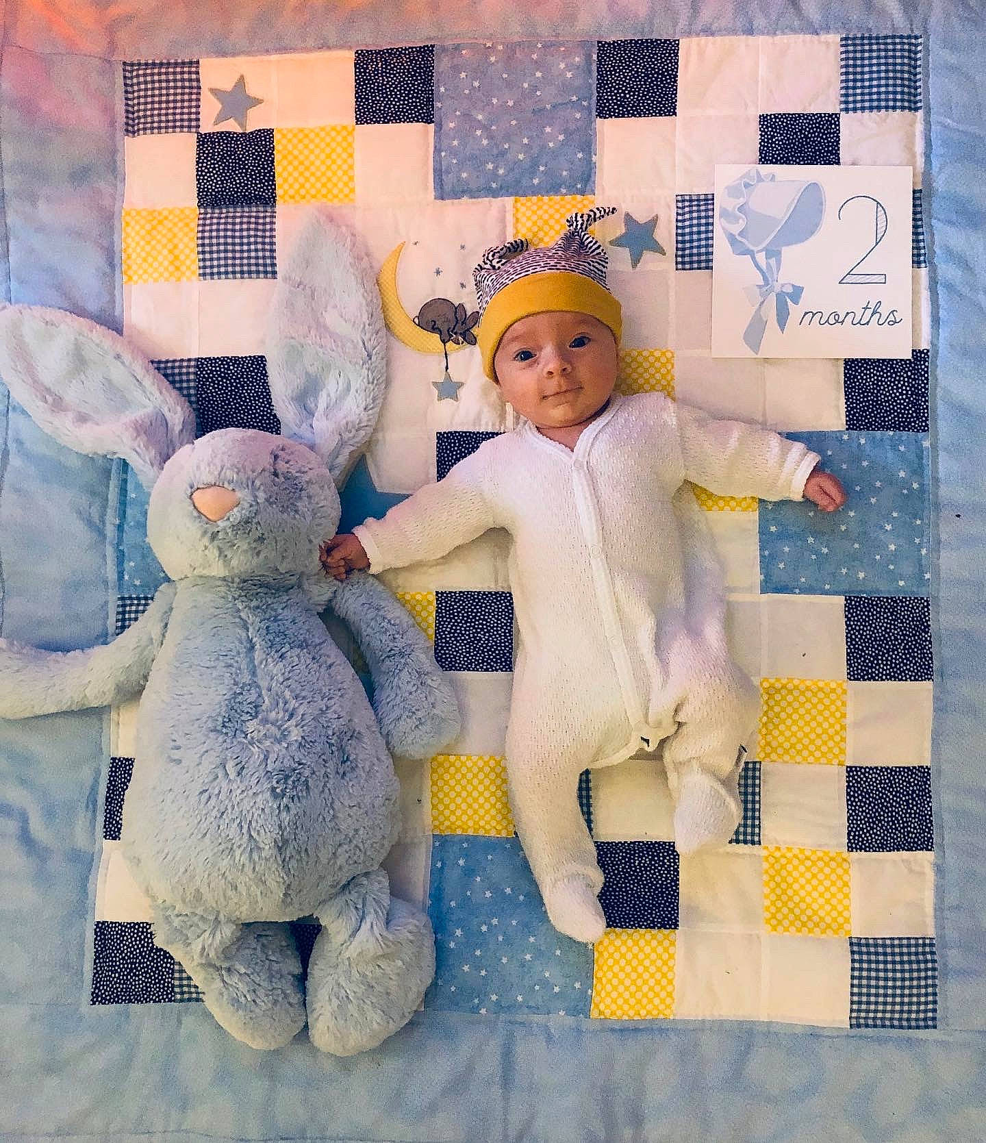 Collins is registered to the contest to win money with this photo: art, bedding, child, craft, creative_arts, design, fawn, headwear, knitting, linens, needlework, patchwork, pattern, person, quilt, quilting, stuffed_toy, textile, toy, yellow