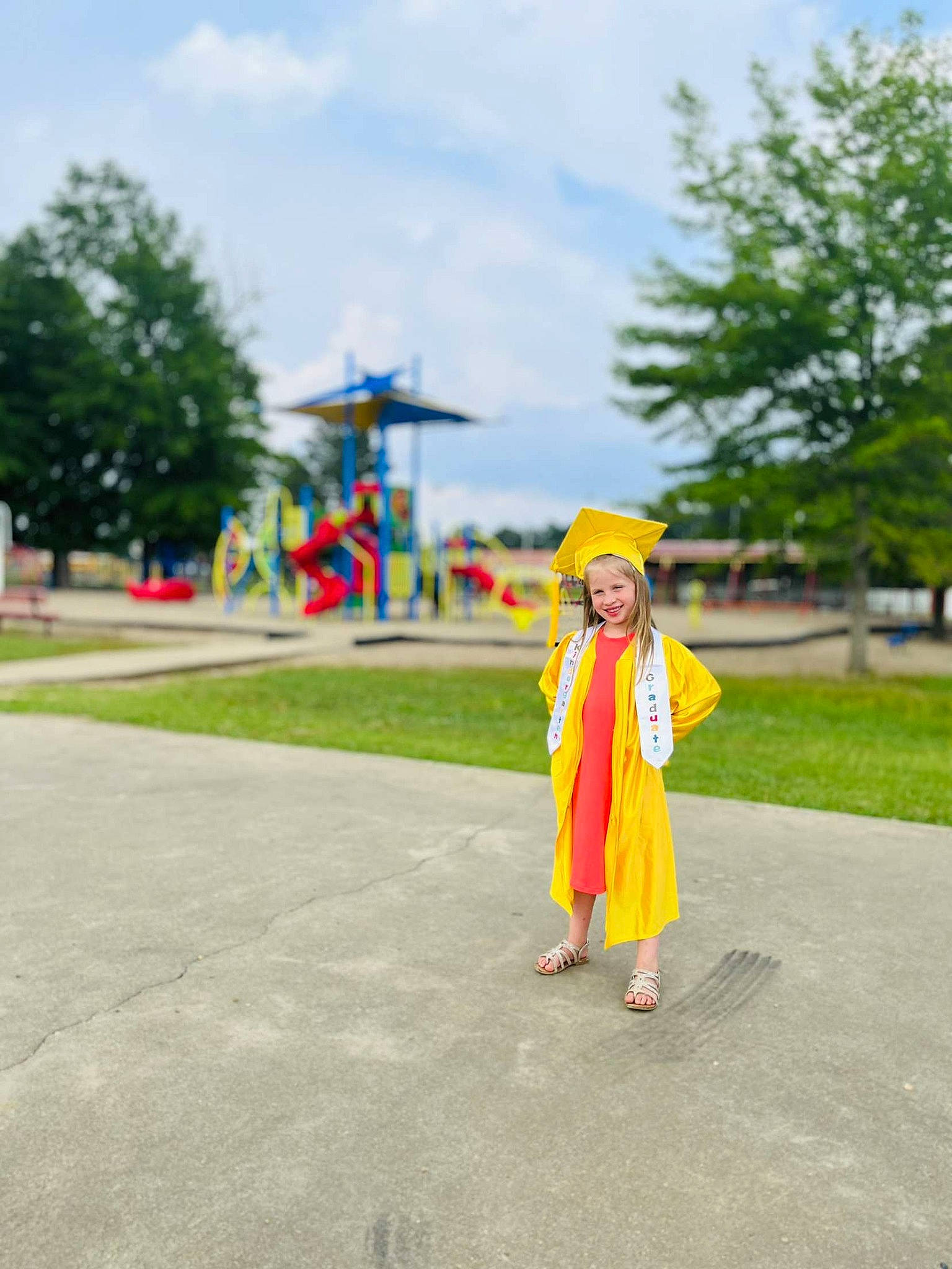 Nevaeh is registered to the contest to win money with this photo: aircraft, asphalt, cloud, costume, event, fun, grass, hat, joy, landscape, leisure, nonbuilding_structure, person, pole, recreation, road, road_surface, sky, street_fashion, toy