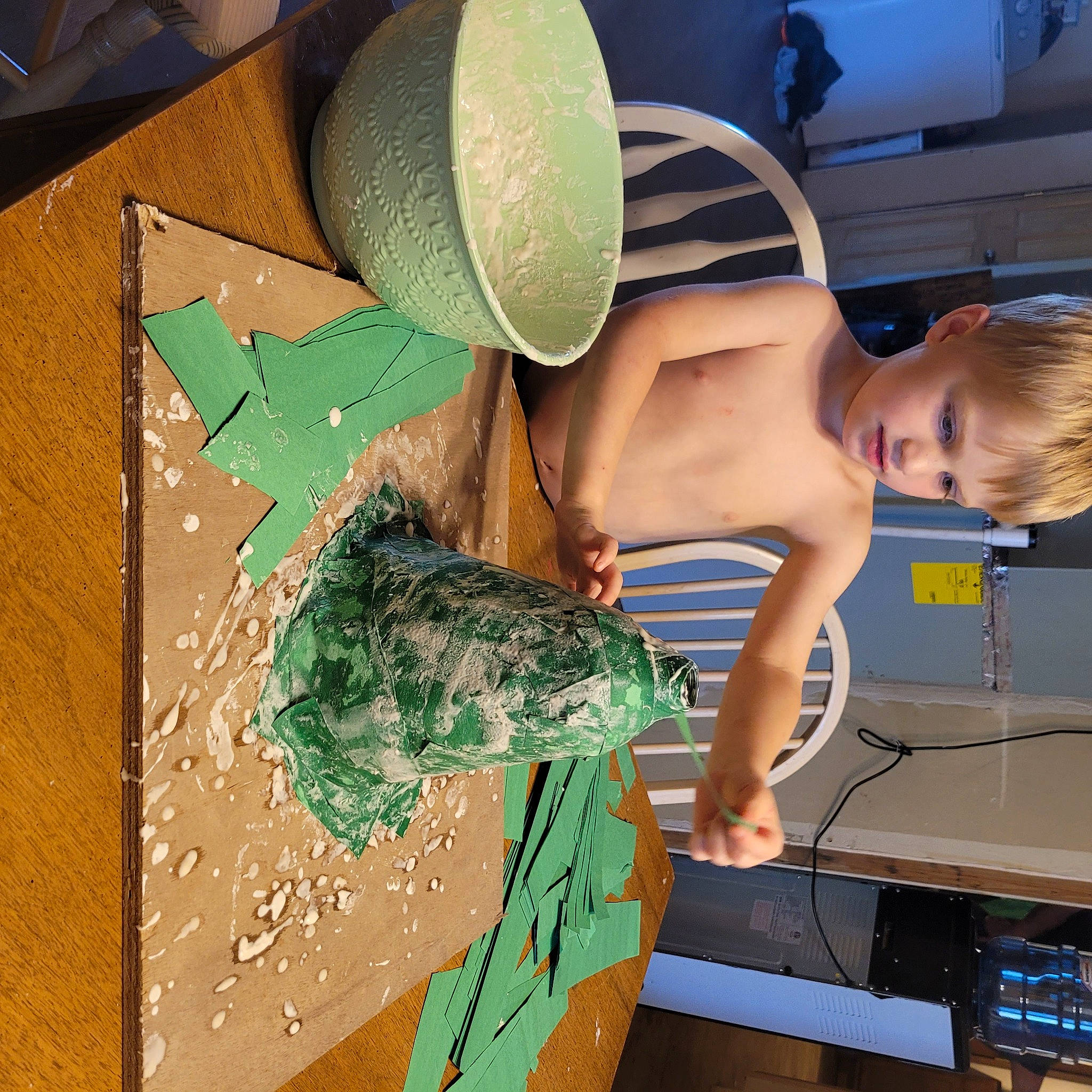 James is registered to the contest to win money with this photo: art, artist, chest, child, design, elbow, eyewear, finger, fun, hat, human_leg, leisure, pattern, person, shoulder, sitting, t_shirt, thigh, toddler, trunk