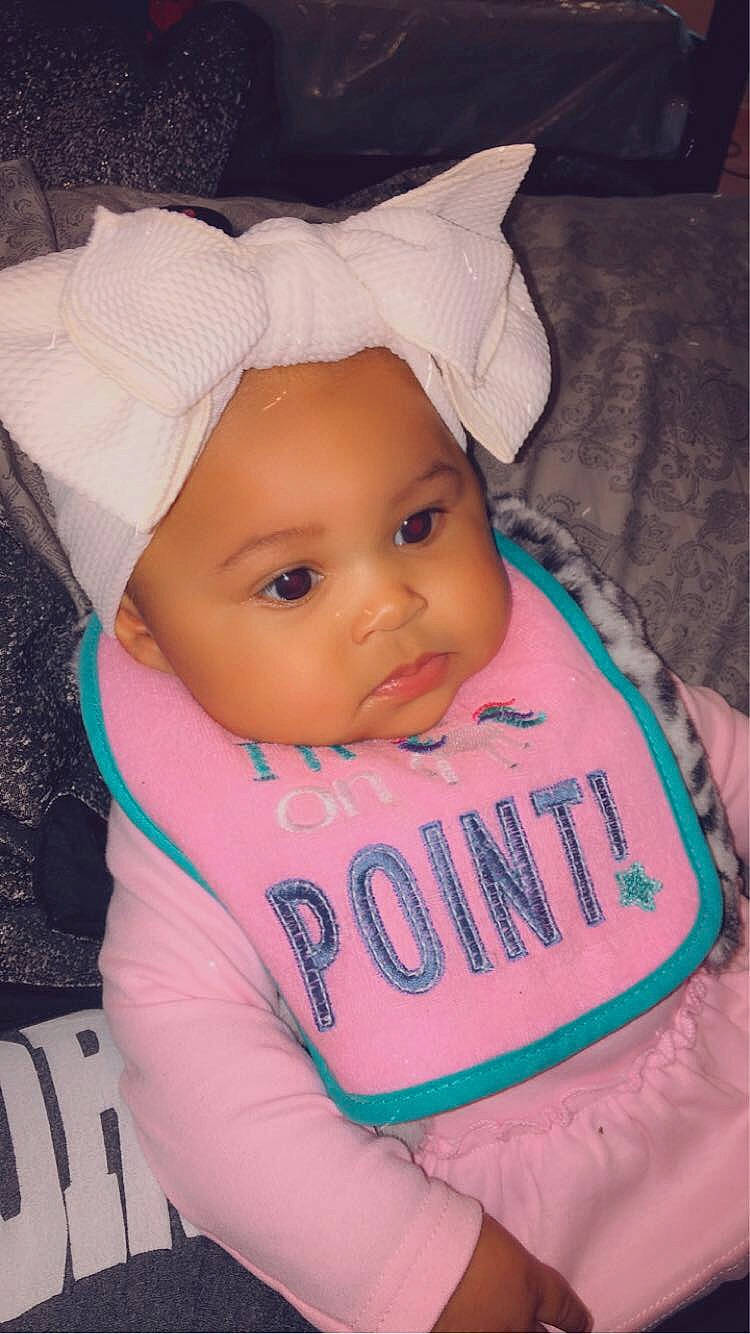 Alyssa is registered to the contest to win money with this photo: baby, baby_products, baby_toddler_clothing, bonnet, cheek, child, comfort, costume_accessory, costume_hat, headband, headwear, hood, hoodie, person, pink, toddler