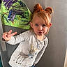 Addalynn joined the competition — help win amazing prizes! child, girl, portrait, indoors, smiling, duck_face, peace_sign, red_hair, hairstyle, hair_buns, earrings, necklace, long_sleeves, shirt, reindeer, jeans, standing, playful, artwork, home