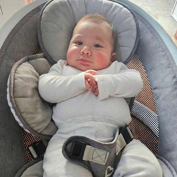 Derek Pérez joined the competition — help win amazing prizes! baby, baby_boy, baby_seat, child, chubby_cheeks, comfortable, cushion, cute, face, hands, home, indoors, infant, portrait, relaxed, resting, seatbelt, soft_lighting, white_clothing, young_child
