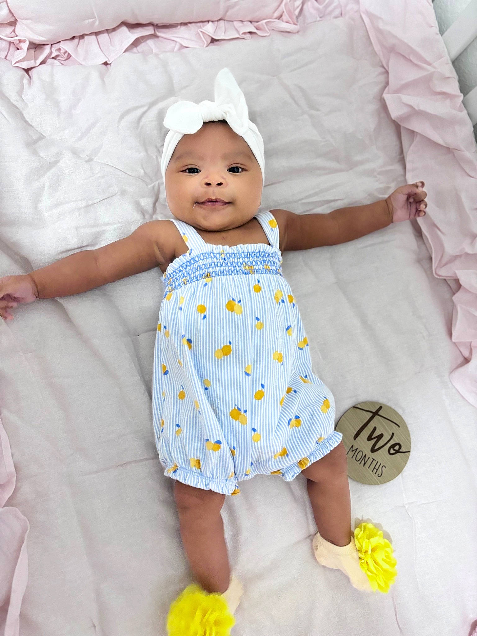 Anya joined the competition — help win amazing prizes! baby, baby_products, baby_toddler_clothing, child, comfort, day_dress, dress, face, happy, headwear, linens, one_piece_garment, pattern, person, pink, skin, sleeve, smile, t_shirt, textile