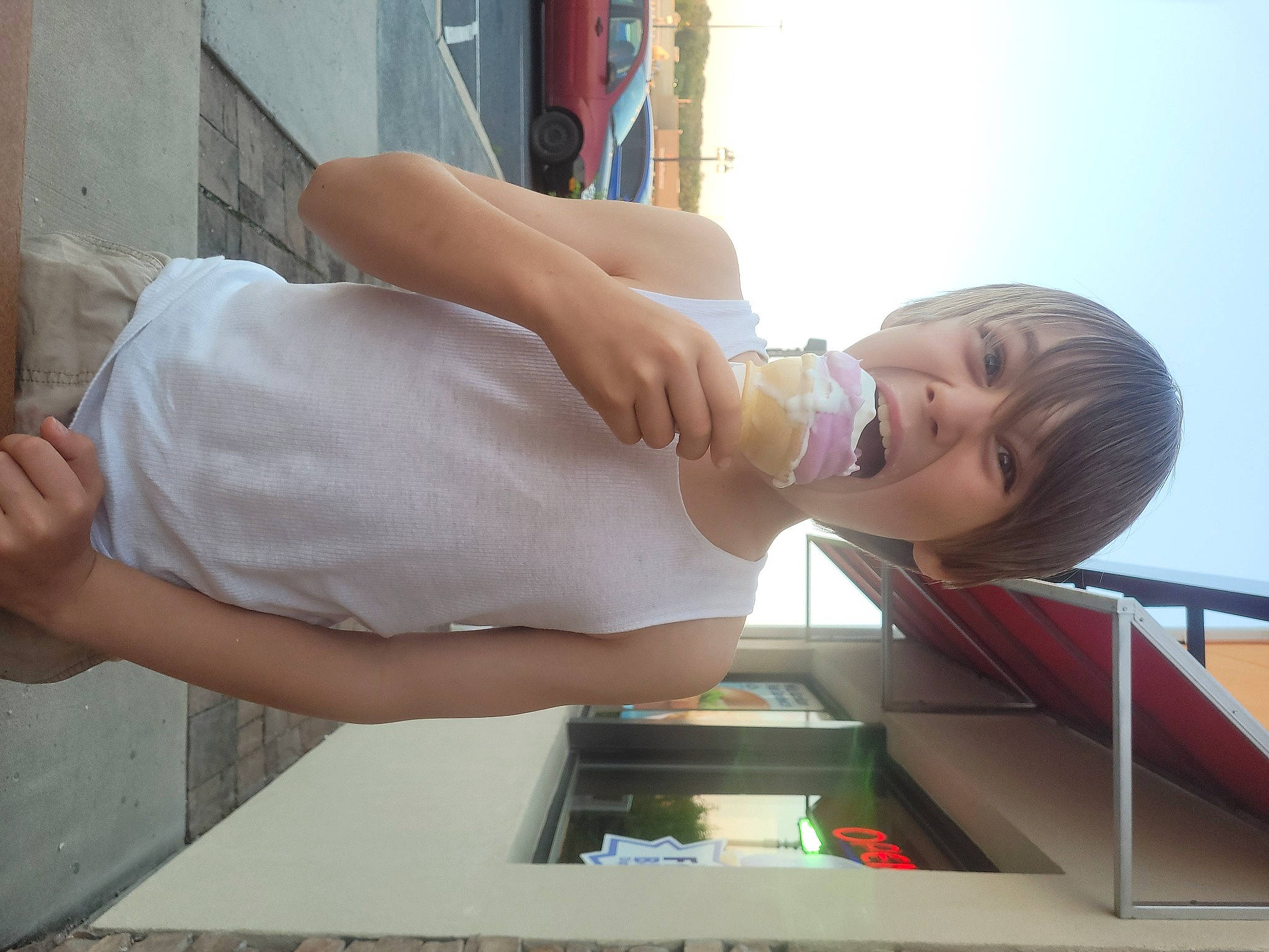 Jensen is registered to the contest to win money with this photo: abdomen, arm, art, chest, elbow, eyewear, finger, gesture, human_leg, joint, knee, person, sculpture, shoulder, sky, statue, thigh, trunk, waist, water