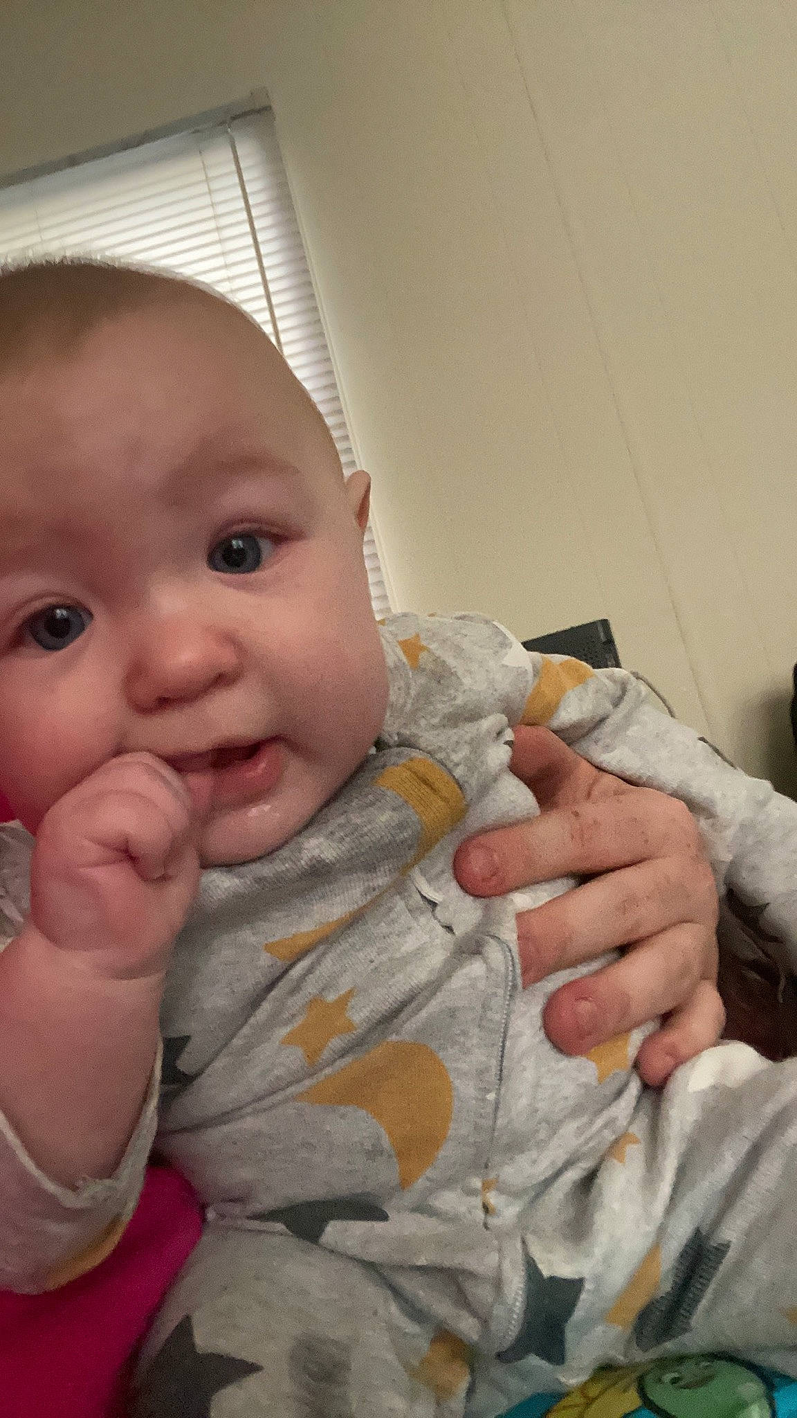 Hendrix is registered to the contest to win money with this photo: baby, baby_toddler_clothing, cheek, drinkware, ear, eye, eyelash, finger, gesture, hand, head, iris, lip, nail, nose, person, skin, sleeve, smile, thumb