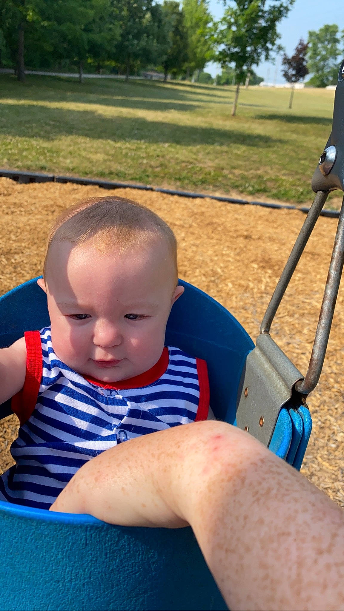 Hendrix is registered to the contest to win money with this photo: baby, baby_products, baby_toddler_clothing, child, city, electric_blue, fun, grass, happy, leisure, pattern, person, play, recreation, sitting, skin, summer, swing, toddler, tree