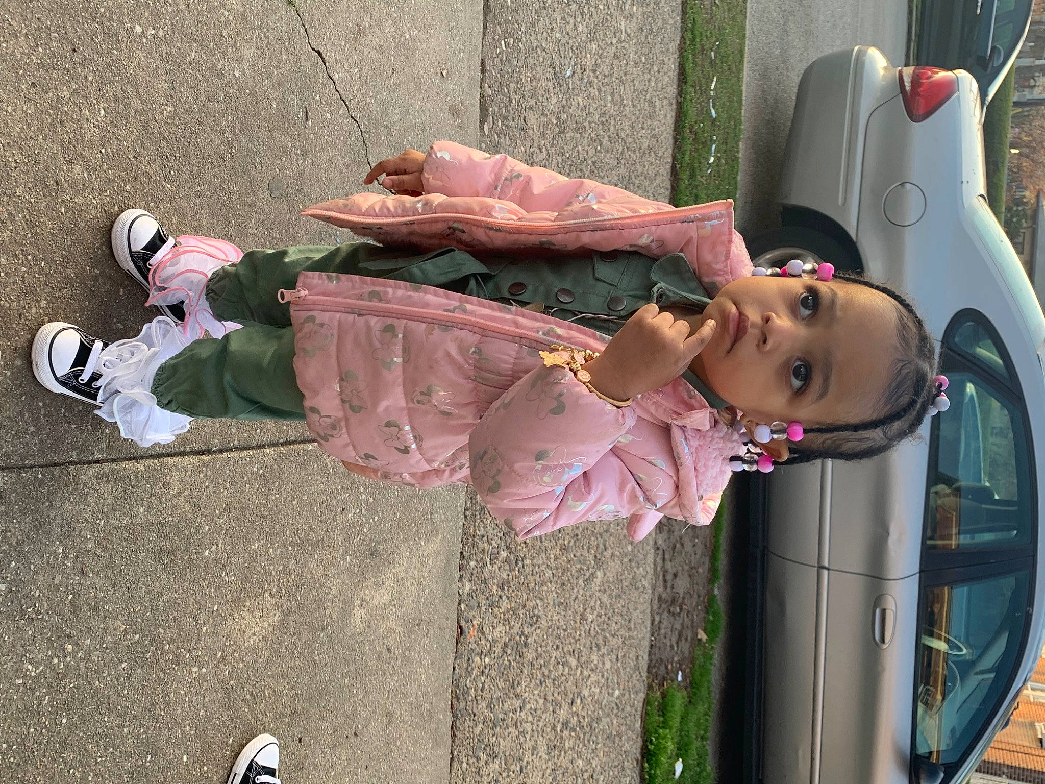 Nilah joined the competition — help win amazing prizes! automotive_exterior, automotive_lighting, car, child, family_car, fun, green, motor_vehicle, person, pink, shoe, sidewalk, smile, sneakers, street_fashion, tire, toddler, vehicle, vehicle_door, wheel