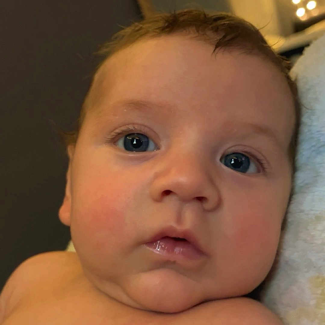 Ryker is registered to the contest to win money with this photo: baby, bed, bedroom, bodypart, face, finger, frown, hand, happy, head, indoors, lighting, mouth, newborn, person, photography, portrait, sad, selfie, smile