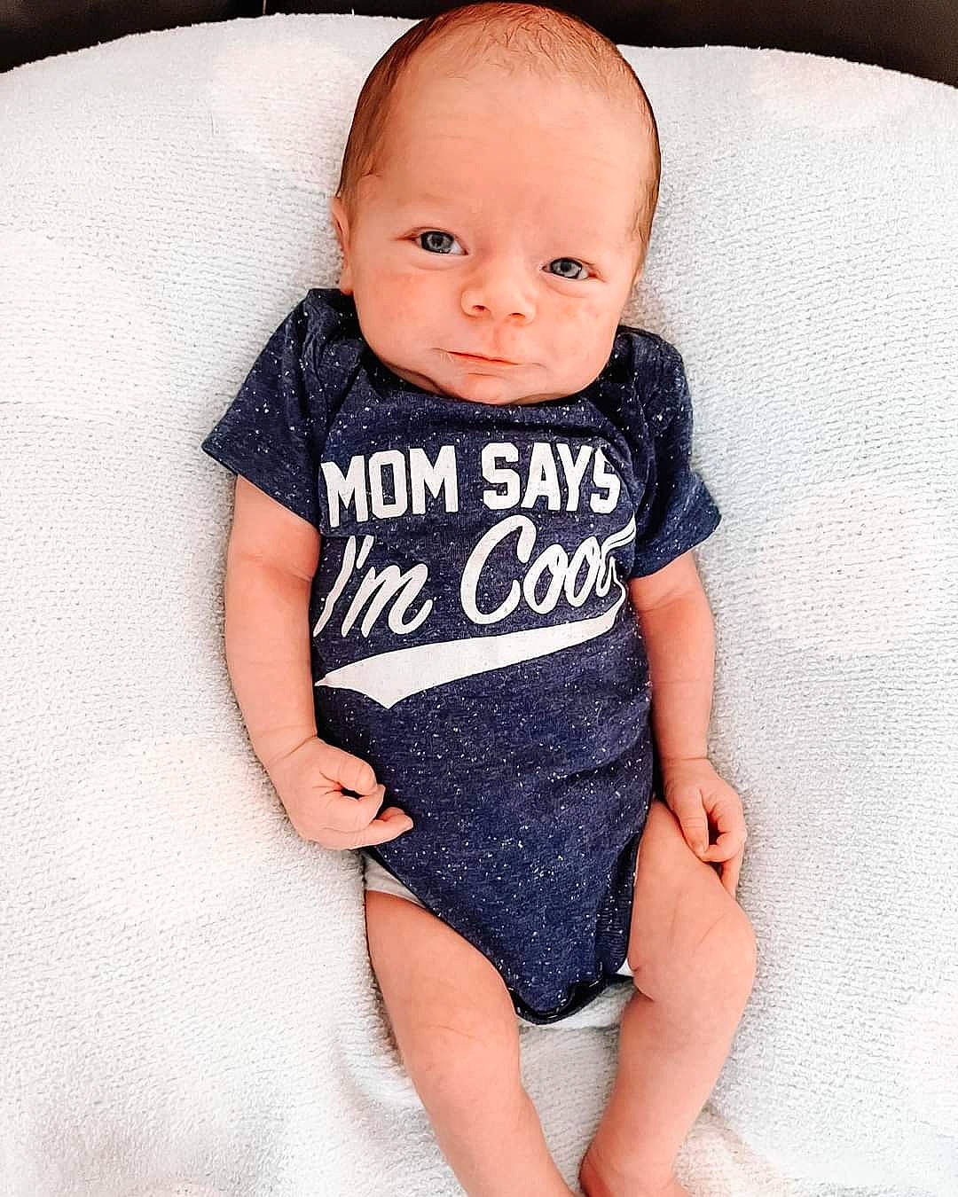 Cole joined the competition — help win amazing prizes! baby, baby_toddler_clothing, cheek, clothing, design, eye, face, grey, human_body, neck, one_piece_garment, outerwear, pattern, person, skin, sleeve, t_shirt, textile, thigh, toddler