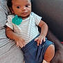 Dedrick joined the competition — help win amazing prizes! baby, child, infant, person, striped_shirt, blue_pants, pacifier, hand, couch, adult, comfort, cute, curious_eyes, skin, clothing, sitting, indoor, relax, family, holding