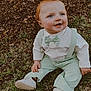 baby, child, grass, tree, outdoor, smiling, happy, blue_eyes, red_hair, suspenders, bow_tie, white_shoes, cute, nature, fall_leaves, sitting, portrait, young_child, casual_clothing, daylight