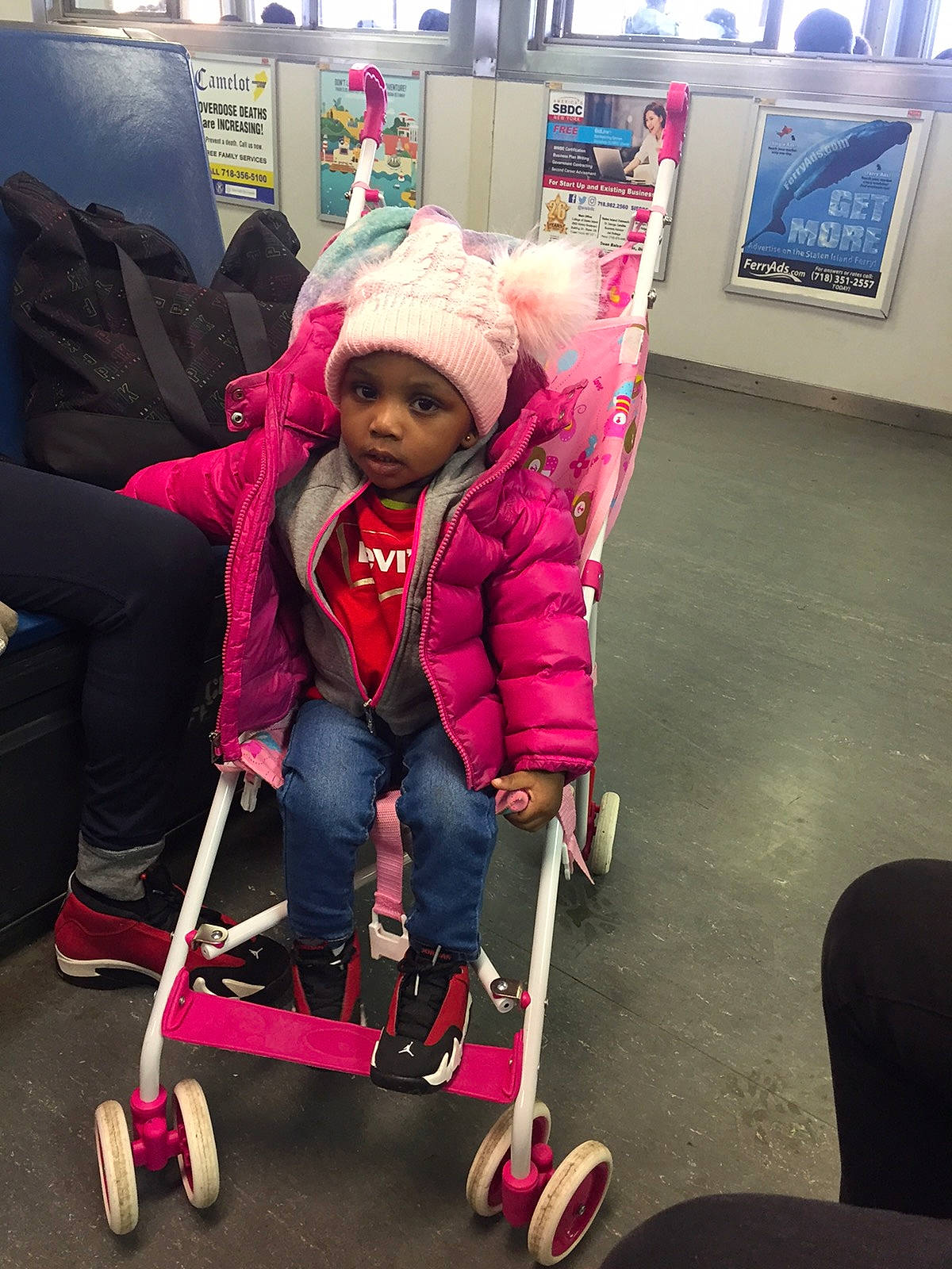 Taniece is registered to the contest to win money with this photo: baby, baby_carriage, baby_products, boot, child, fun, hat, headwear, jacket, knee, lap, leisure, magenta, person, play, recreation, riding_toy, sitting, smile, tire