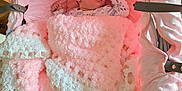 Alyissa joined the competition — help win amazing prizes! baby, infant, blanket, bassinet, pink, plush_toy, soft_toy, cushion, sleeping_area, child, newborn, cozy, indoors, fabric, texture, resting, person, cute, wrapped, bed