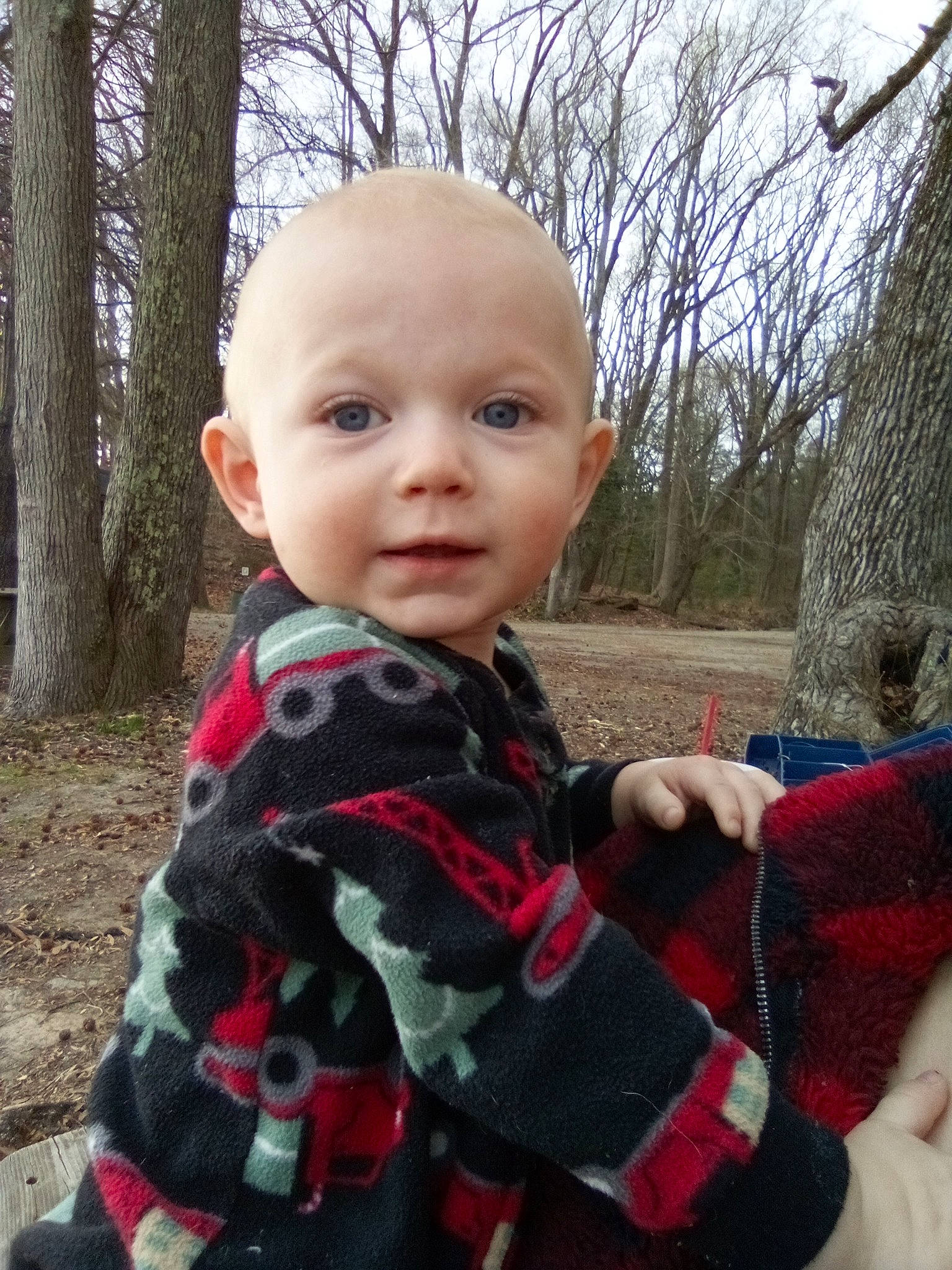 Colton is registered to the contest to win money with this photo: baby, baby_toddler_clothing, carmine, child, cool, eye, fun, grass, leisure, pattern, person, plaid, plant, sitting, skin, sky, sleeve, tartan, toddler, tree