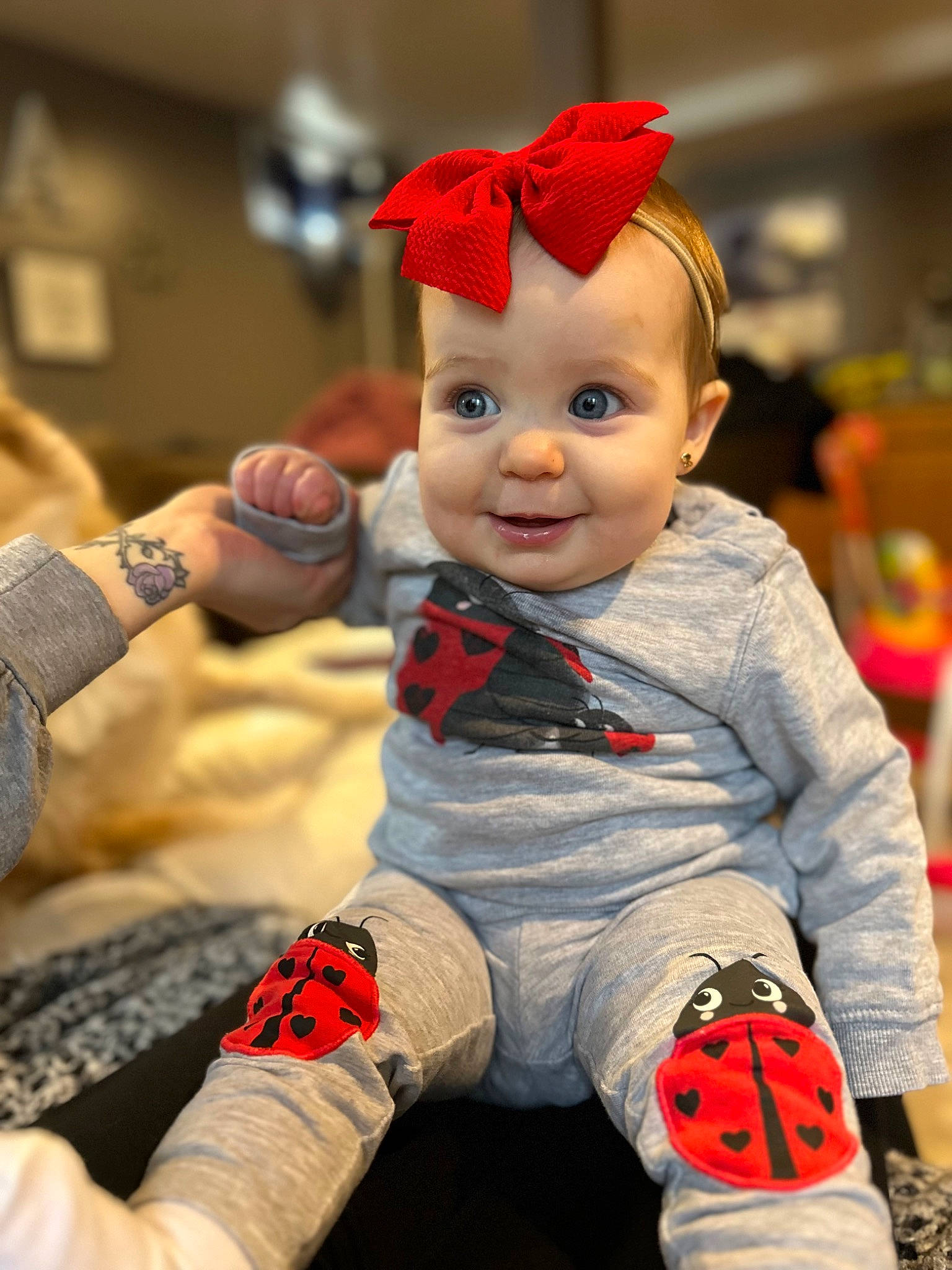 Ryleigh joined the competition — help win amazing prizes! baby, carmine, child, costume, costume_hat, event, fictional_character, flooring, fun, happy, holiday, joy, orange, person, play, recreation, room, sitting, smile, toddler