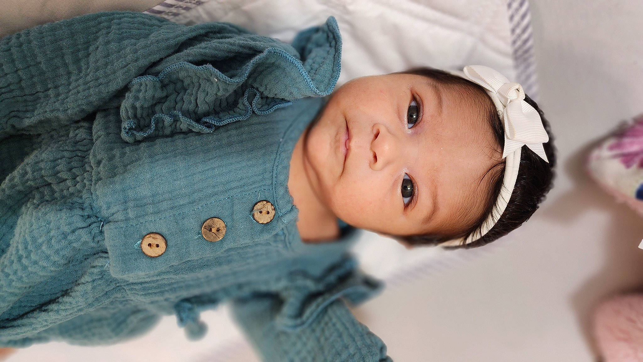 Avianna is registered to the contest to win money with this photo: baby, baby_toddler_clothing, cheek, dress, eye, eyelash, face, fashion, grey, head, headgear, human_body, lip, nose, outerwear, person, skin, sleeve, textile, tree