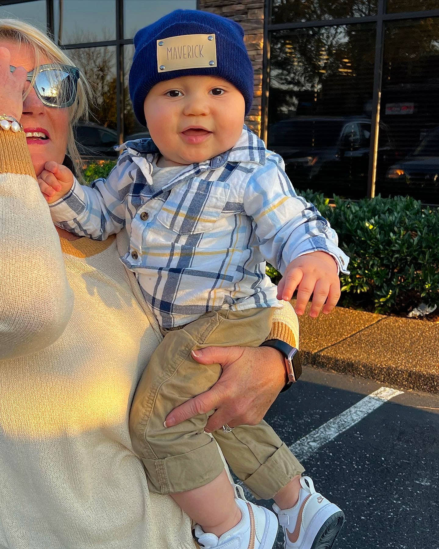 Maverick is registered to the contest to win money with this photo: baby, baby_toddler_clothing, baseball_cap, cap, electric_blue, gesture, grass, happy, hat, headwear, knee, leisure, person, plant, recreation, sitting, skin, sleeve, smile, snapshot