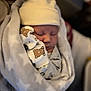 newborn, baby, sleeping, blanket, hat, mittens, bear_print, cozy, infant, cute, wrapped, soft, tiny, peaceful, indoor, warm, closeup, person, child, portrait