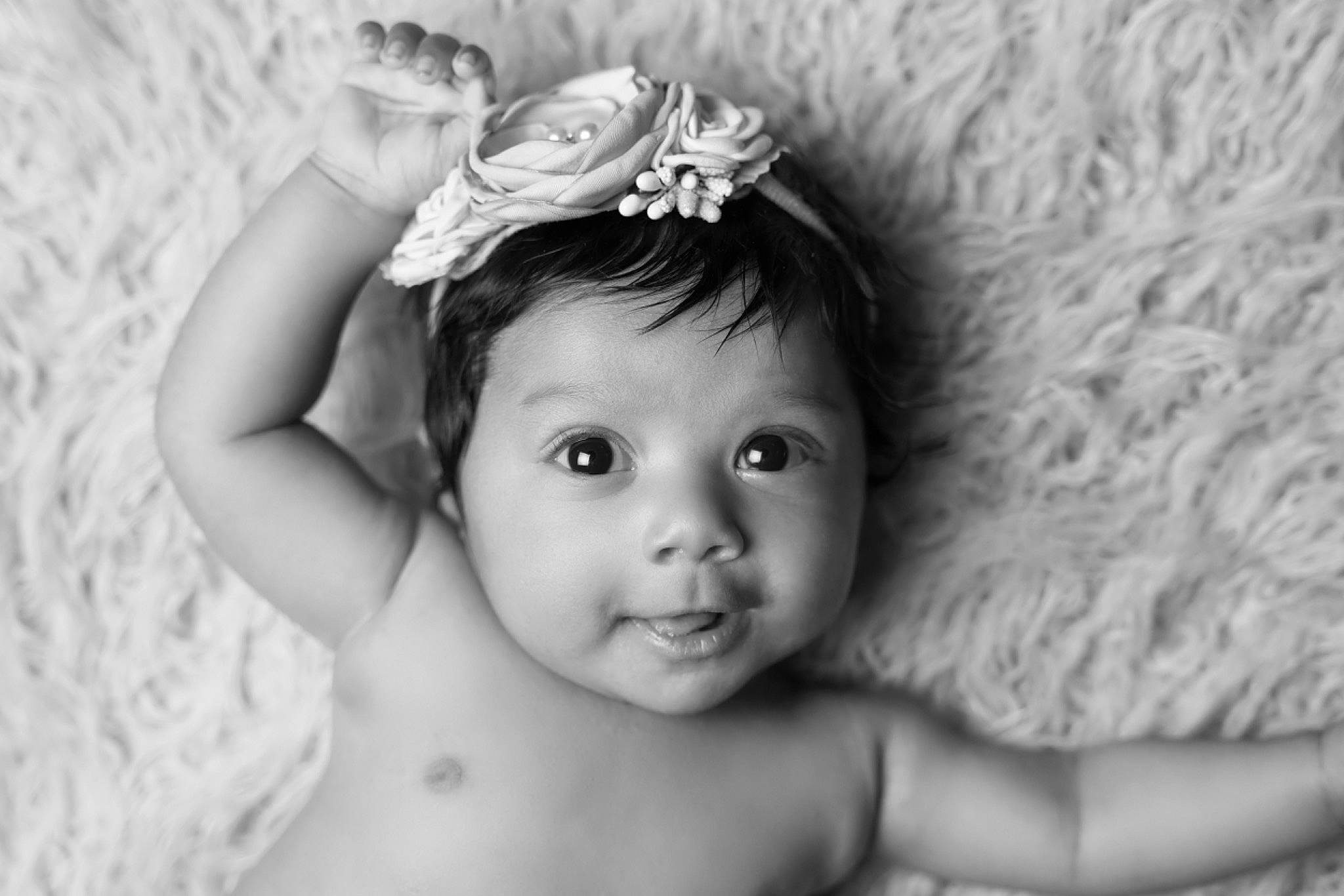 Manraj Kaur Pannu is registered to the contest to win money with this photo: baby, cheek, child, chin, eye, eyebrow, eyelash, facial_expression, flash_photography, flower, fun, gesture, happy, headpiece, iris, lip, person, petal, skin, smile