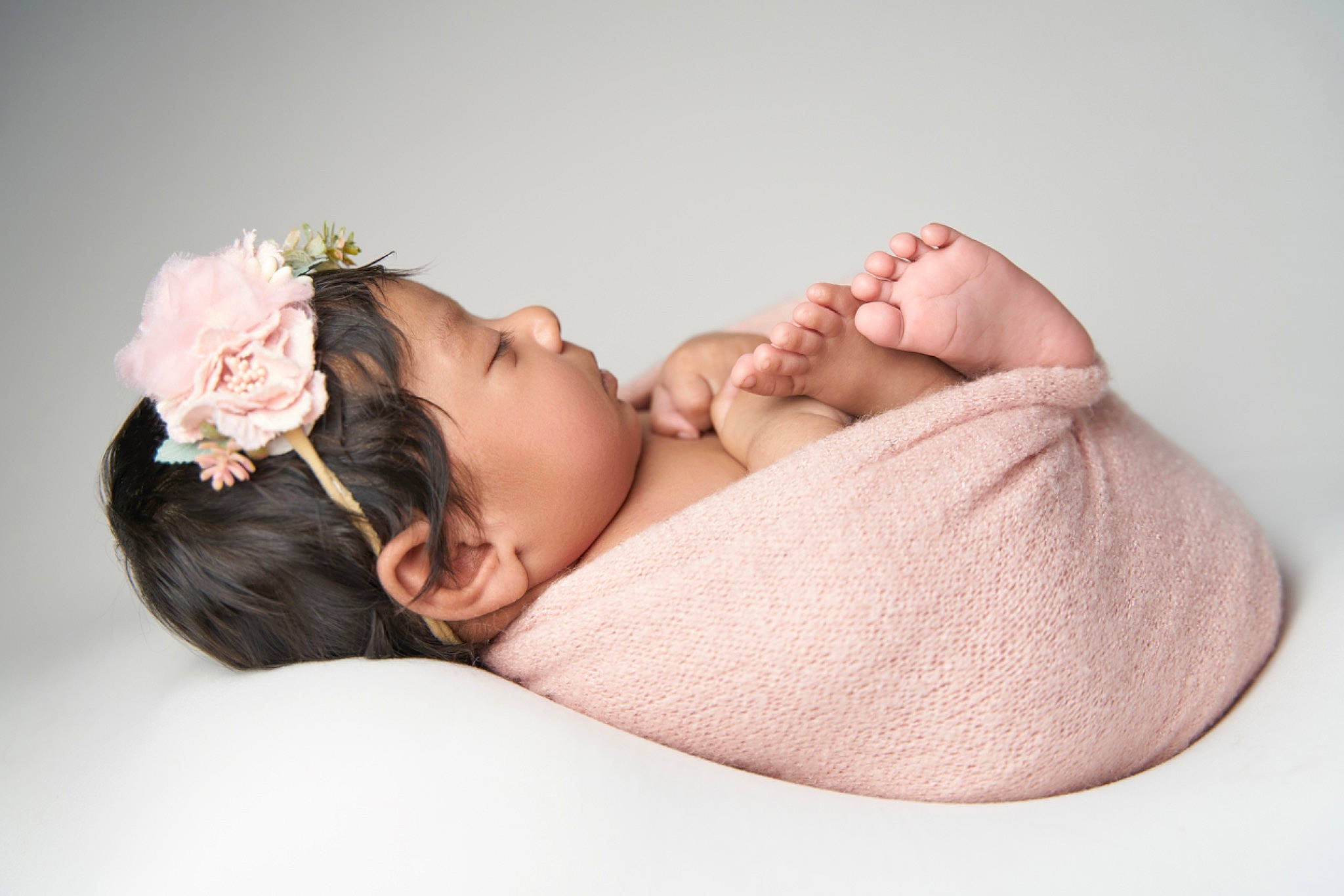 Manraj Kaur Pannu is registered to the contest to win money with this photo: arm, baby, baby_sleeping, baby_toddler_clothing, cap, child, comfort, eyelash, flower, hair_accessory, hand, headband, headgear, headpiece, jewellery, neck, person, petal, skin, sleeve