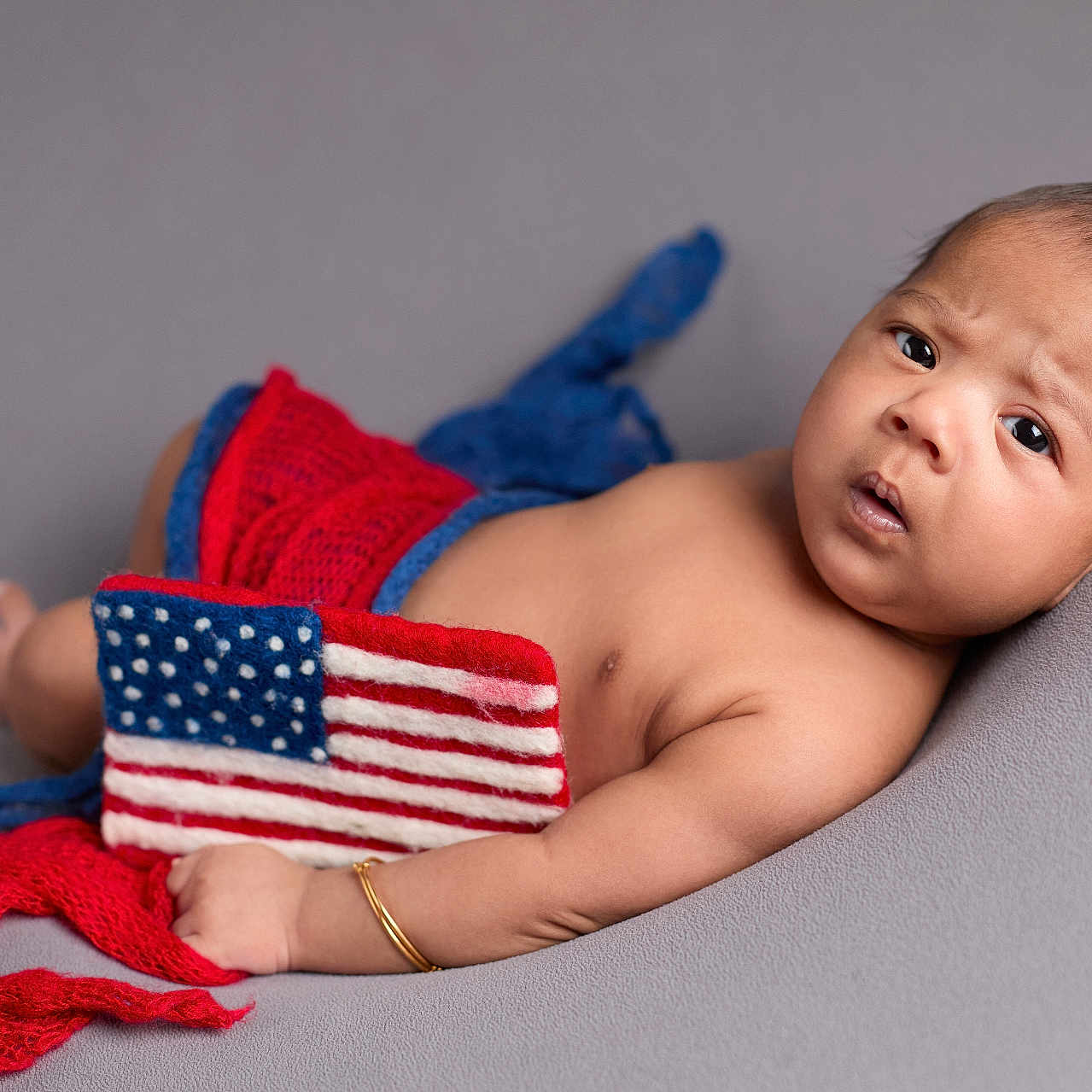 Tegraj joined the competition — help win amazing prizes! americanflag, baby, blanket, bodypart, clothing, face, finger, flag, frown, glove, hand, happy, head, hosiery, newborn, person, photography, portrait, smile, sock