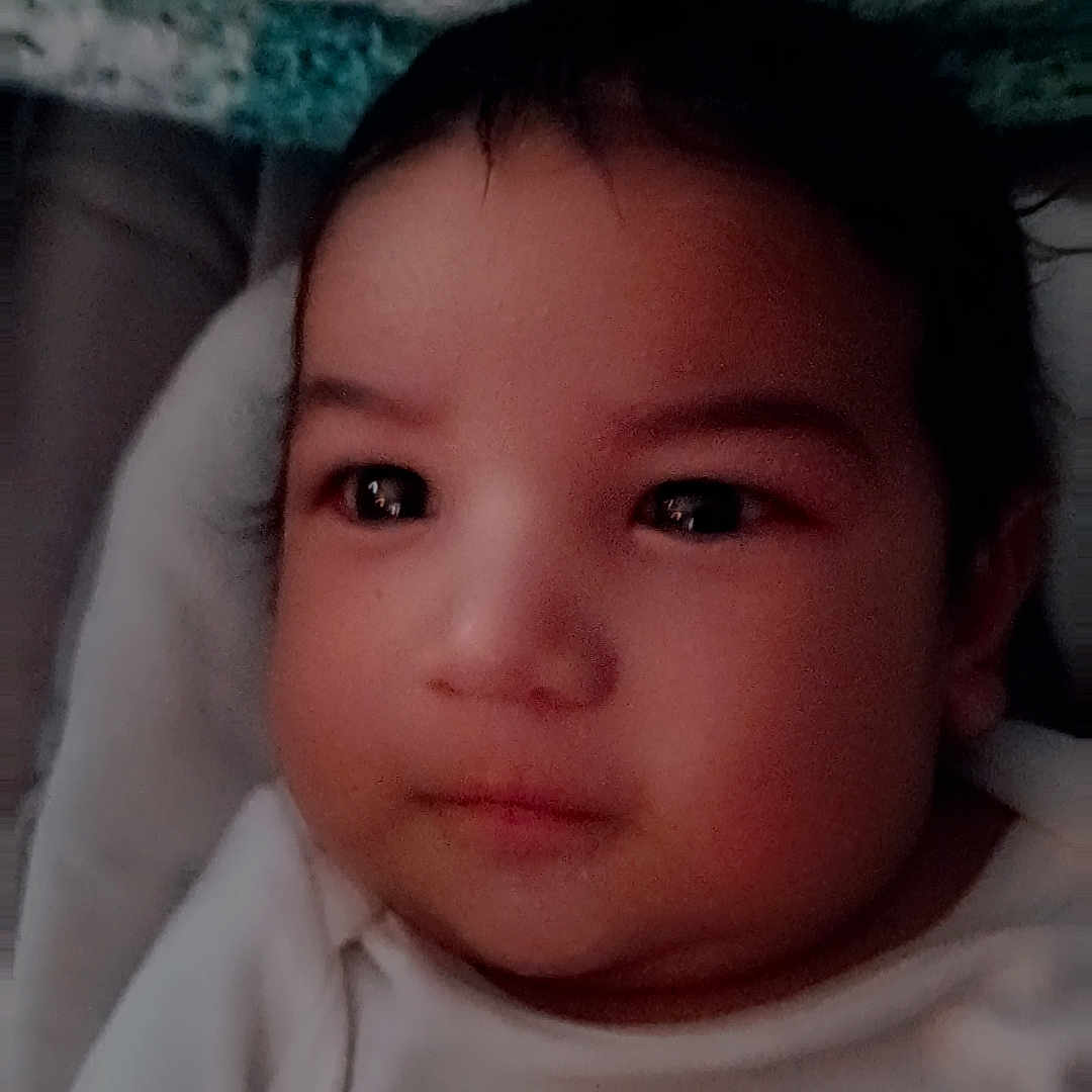 Ramiro is registered to the contest to win money with this photo: baby, bed, blanket, bodypart, clothing, crib, face, finger, frown, furniture, hand, happy, hat, head, infantbed, newborn, person, photography, portrait, smile