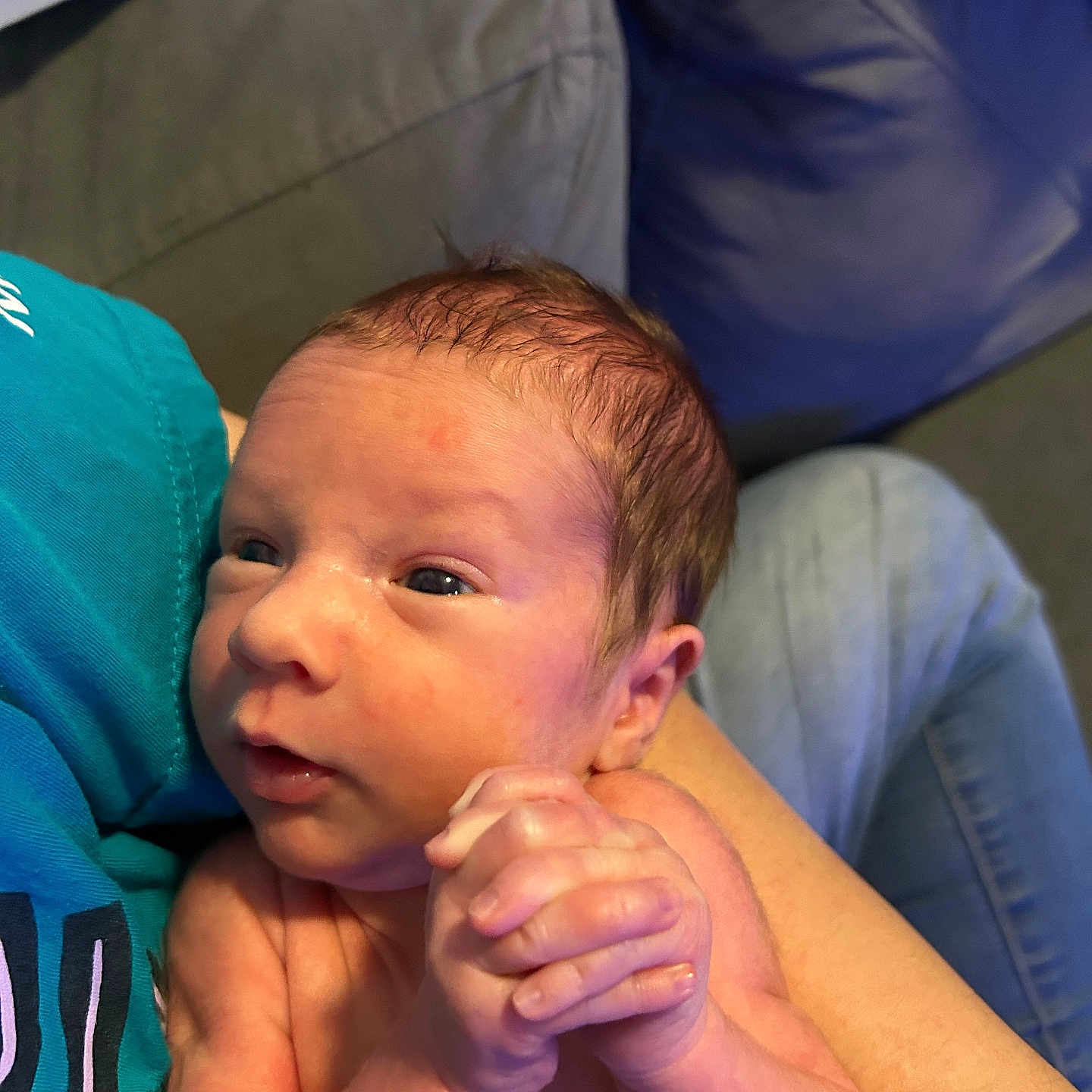 Garen is registered to the contest to win money with this photo: adult, arm, baby, bodypart, couch, cushion, face, finger, furniture, hand, happy, head, homedecor, male, man, newborn, person, photography, portrait, wrist