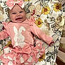 Marymae joined the competition — help win amazing prizes! baby, child, pink_clothing, bow, smiling, lying_down, floral_pattern, easter, cute, infant, tutu_skirt, headband, celebration, happy, indoors, person, fabric, soft_lighting, portrait, holiday