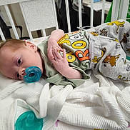 Jesse joined the competition — help win amazing prizes! baby, pacifier, crib, blanket, clothing, infant, sleepwear, bed, child, cartoon, cute, resting, indoor, young, person, soft, comfort, toddler, sleep, nursery