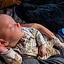 Jesse is registered to the contest to win money with this photo: baby, sleeping, pajamas, infant, tattoo, hand, bed, blanket, person, cute, cozy, sleep, clothing, relaxation, rest, indoor, portrait, newborn, skin, comfort