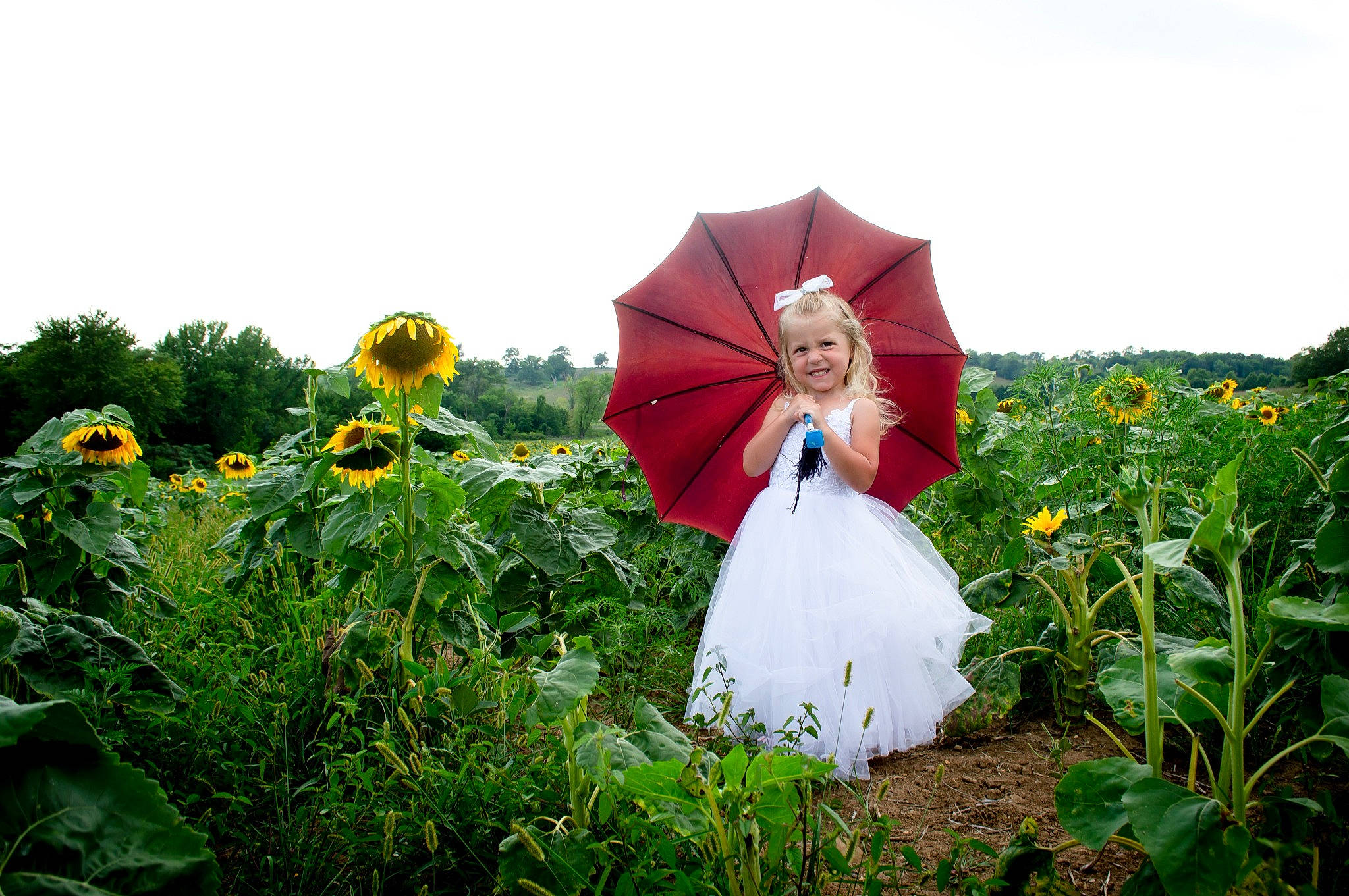 Kaislee is registered to the contest to win money with this photo: dress, field, flower, flowering_plant, formal_wear, grass, grassland, happy, joy, landscape, leisure, meadow, natural_landscape, people_in_nature, person, petal, plant, pole, prairie, sky