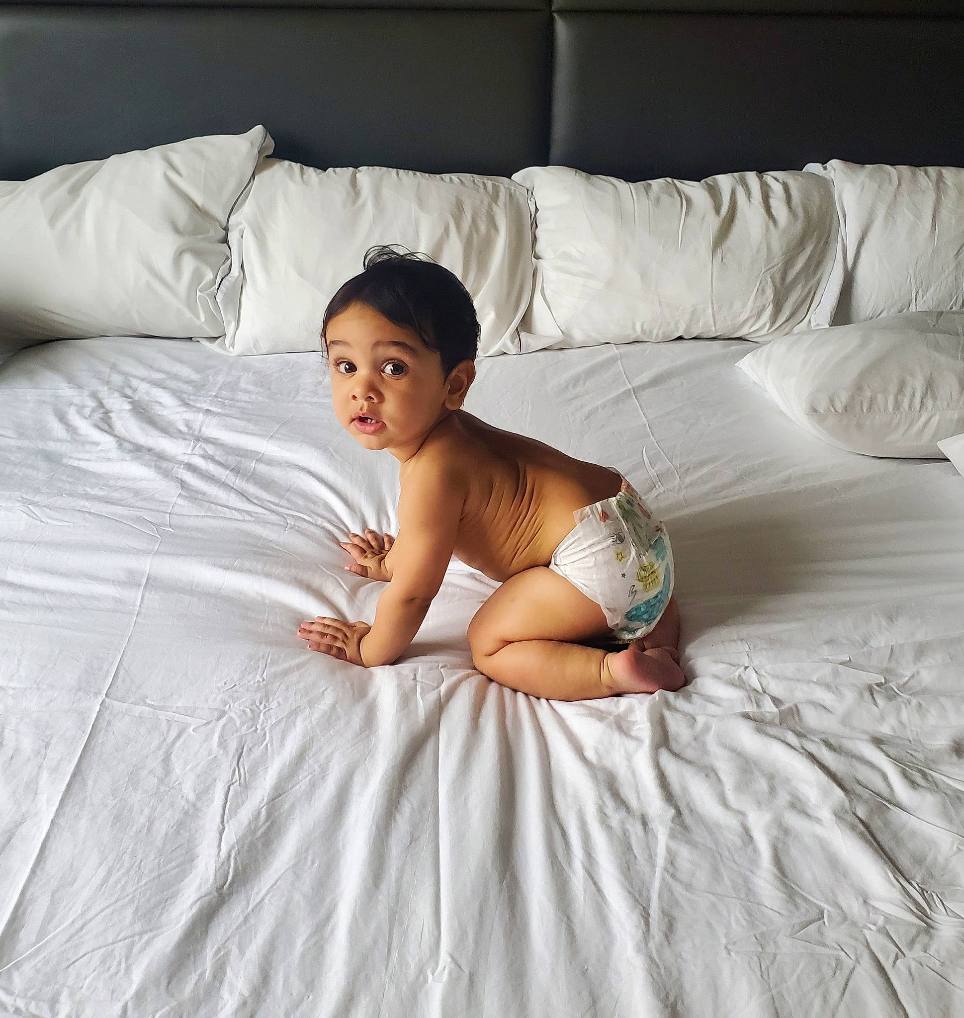Madden joined the competition — help win amazing prizes! baby, barefoot, bed, bed_sheet, bedding, child, comfort, furniture, leg, linens, mattress, mattress_pad, person, photo_shoot, photography, pillow, room, skin, surprise, textile