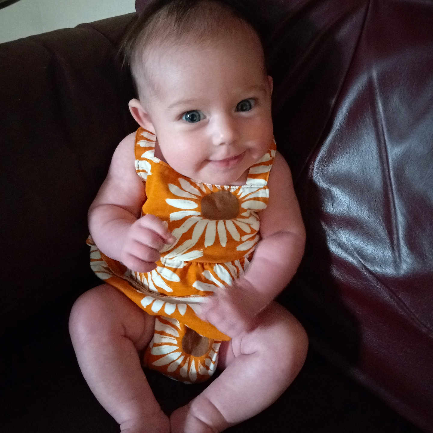 Arrow is registered to the contest to win money with this photo: baby, bodypart, chair, clothing, couch, cushion, dress, face, finger, furniture, hand, happy, head, homedecor, newborn, person, photography, portrait, sitting, smile