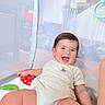Micah joined the competition — help win amazing prizes! baby, smiling, child, onesie, playpen, mesh, happy, indoor, infant, crawling, cute, face, person, skin, young, comfort, relaxing, toy, colorful, babyplaypen