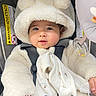 baby, infant, car_seat, fluffy_hoodie, bear_ears, blanket, cute, child, clothing, seatbelt, portrait, indoor, soft_texture, smiling, face, hand, toy, comfort, warm_clothing, adorable