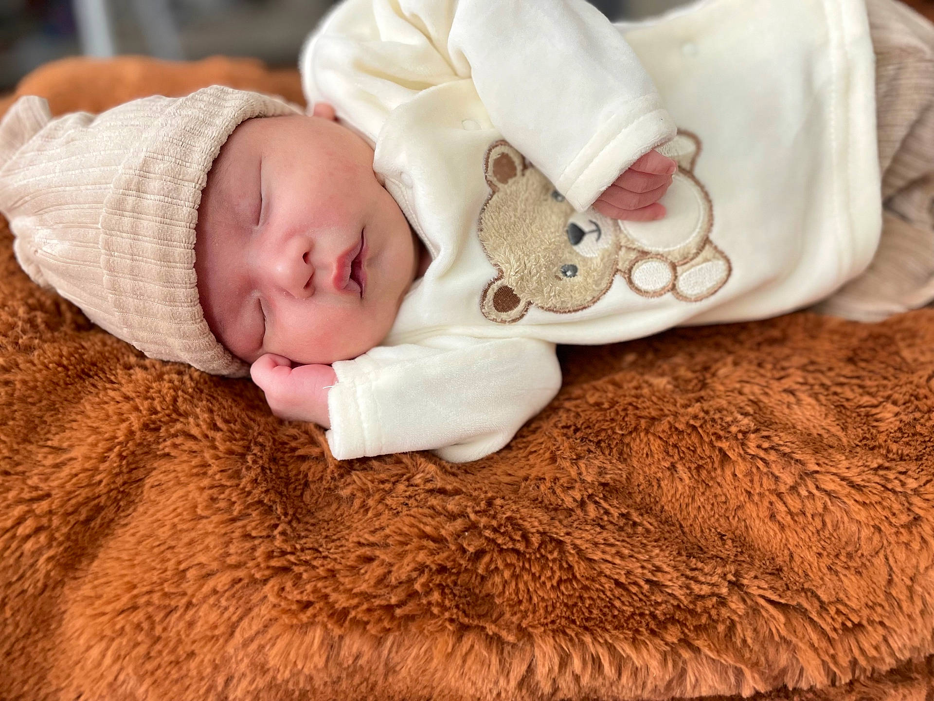 Grayson joined the competition — help win amazing prizes! baby, blanket, bonnet, cap, clothing, face, happy, hat, head, newborn, person, photography, portrait, quilt, sleeping, smile