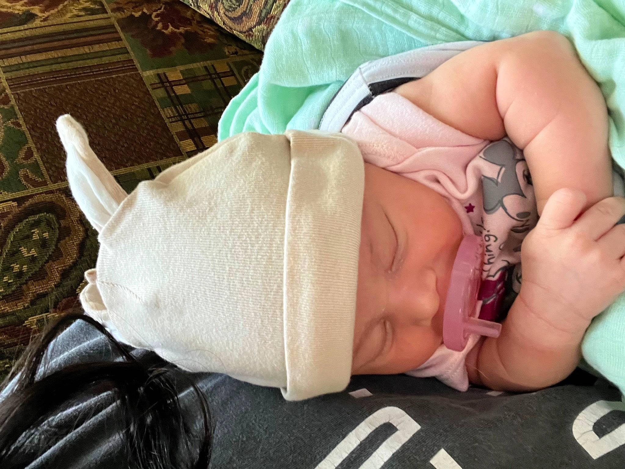 Alize is registered to the contest to win money with this photo: arm, baby, baby_sleeping, baby_toddler_clothing, comfort, eye, eyelash, eyewear, finger, glasses, hand, head, headwear, human_body, leg, mammal, mouth, person, skin, sunglasses