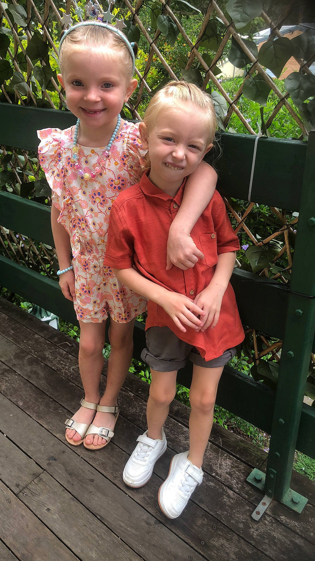 Colton is registered to the contest to win money with this photo: dress, eye, face, fun, grass, green, hair, happy, head, human_body, joy, leg, leisure, person, photograph, pink, plant, product, shorts, skin