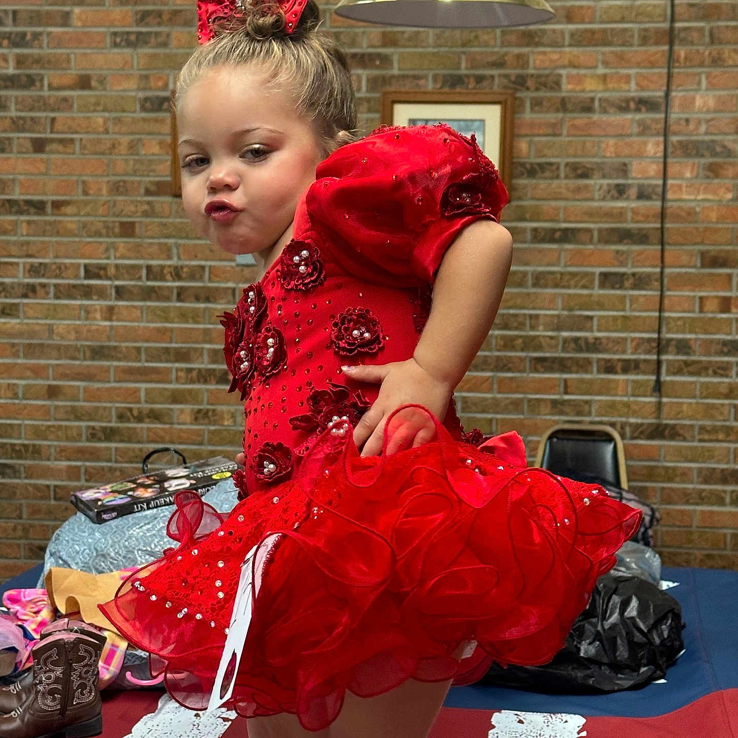 Legacy joined the competition — help win amazing prizes! boots, bow, brick_wall, chair, child, cute, dance, decorative_dress, expression, fabric, girl, indoor, lighting, person, playful, pose, pout, red_dress, table, toddler