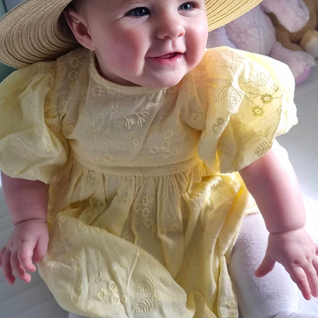 Hestia joined the competition — help win amazing prizes! baby, bodypart, bonnet, cap, clothing, costume, dress, face, finger, happy, hat, head, homedecor, person, photography, portrait, sitting, smile, sunhat, toy