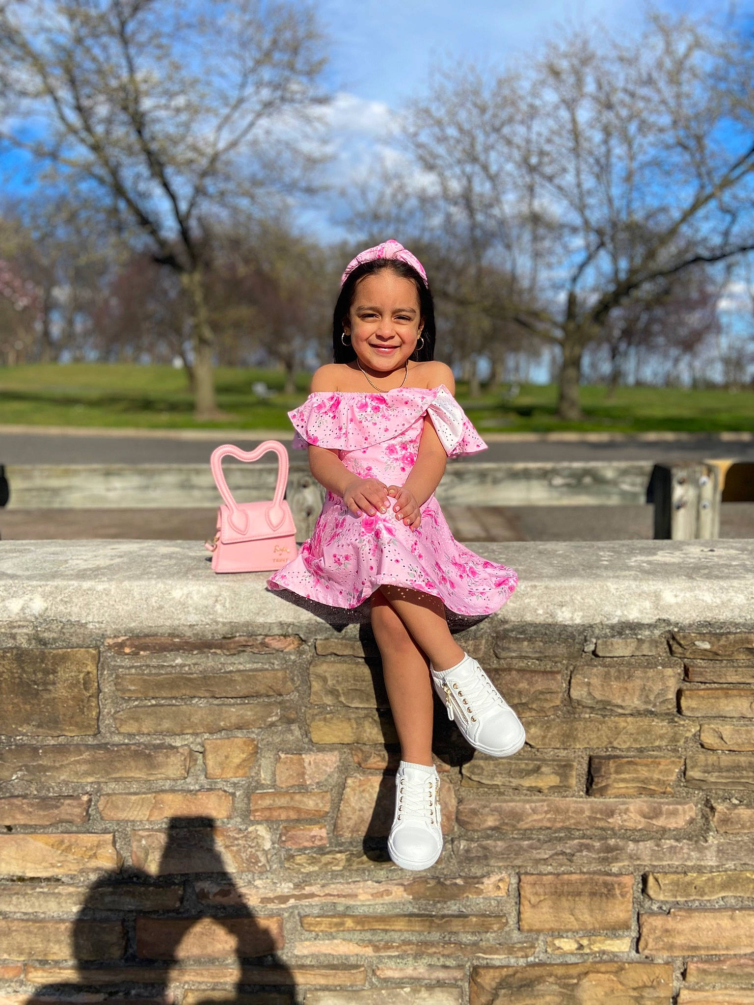 Emma is registered to the contest to win money with this photo: blond, boot, brown_hair, flash_photography, fun, grass, happy, human_leg, joy, leisure, long_hair, magenta, people_in_nature, person, pink, plant, recreation, sky, smile, thigh