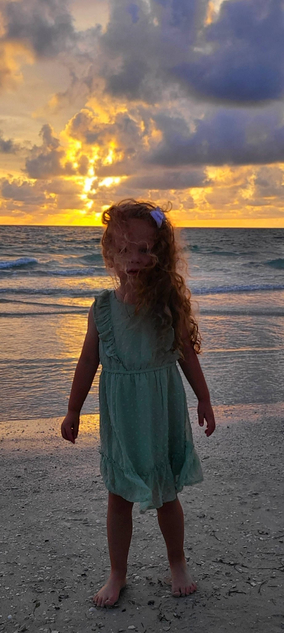 Brynlee is registered to the contest to win money with this photo: azure, beach, cloud, dress, dusk, flash_photography, fun, happy, horizon, long_hair, people_in_nature, people_on_beach, person, sand, sky, standing, sunlight, sunrise, sunset, waist