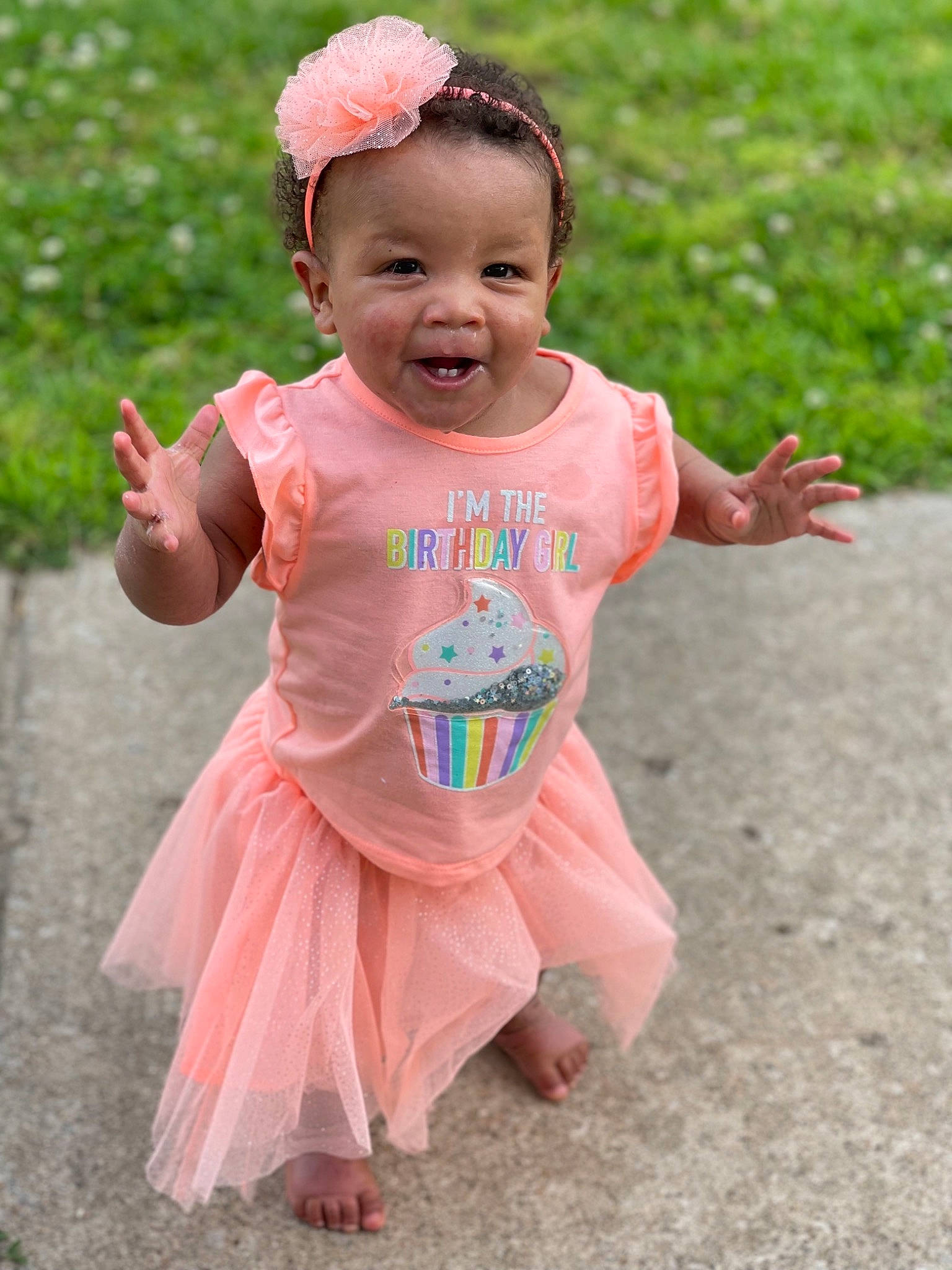 Lai Lani is registered to the contest to win money with this photo: baby, baby_toddler_clothing, child, chin, face, fun, grass, happy, head, leisure, magenta, person, pink, plant, recreation, red, skin, sleeve, smile, summer